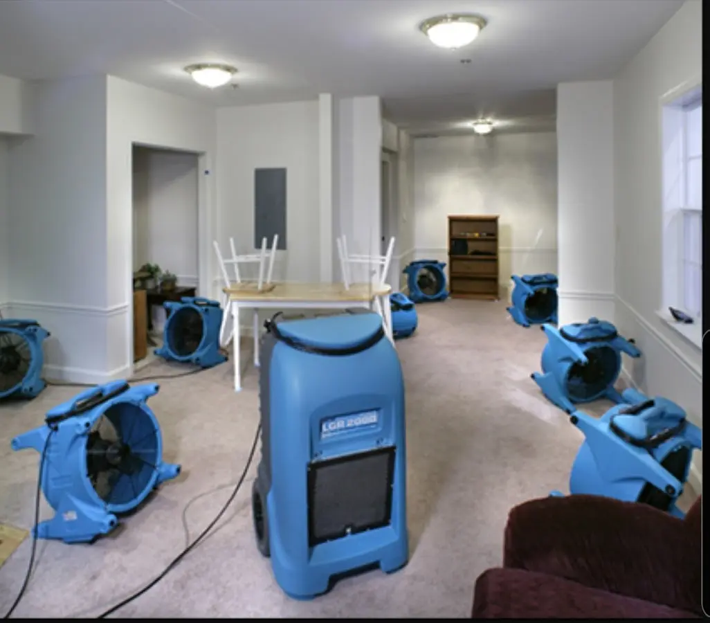 Air movers and dehumidifier setup for Water Damage Restoration in Elwood